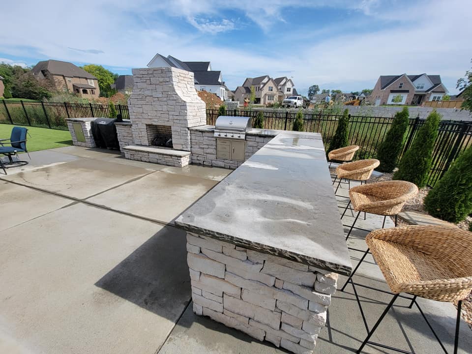 outdoor kitchen and fireplace