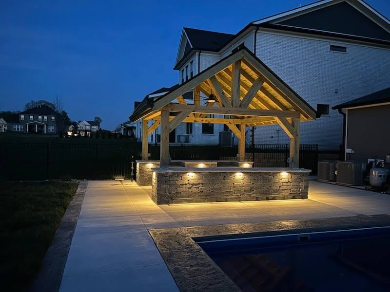 stone patio with pergola and LED lighting
