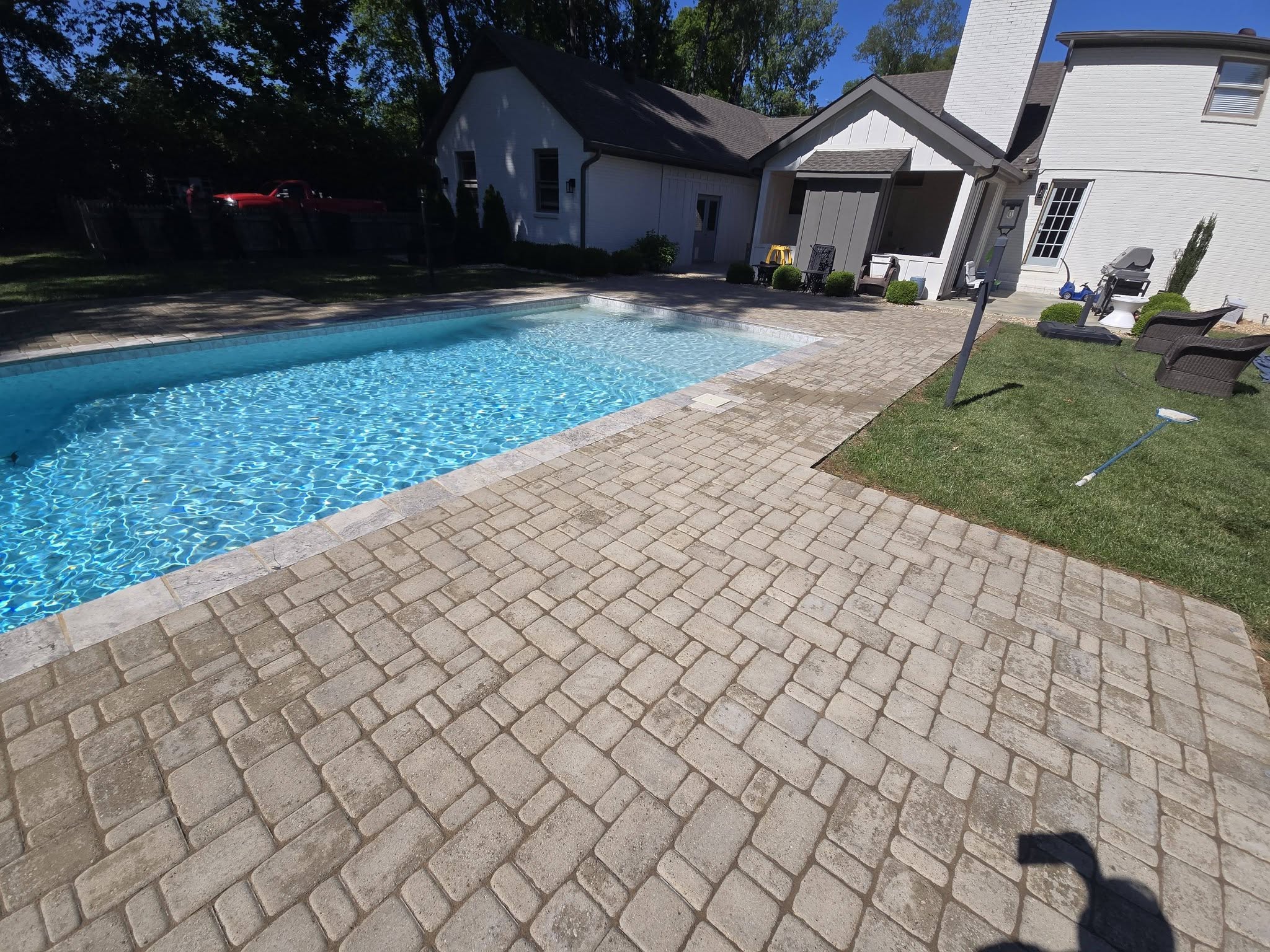 pool with custom stone pavers