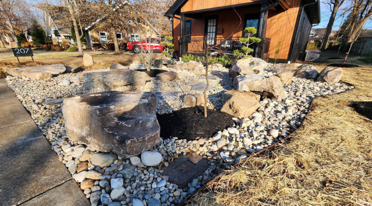 flowerbed with stone elements