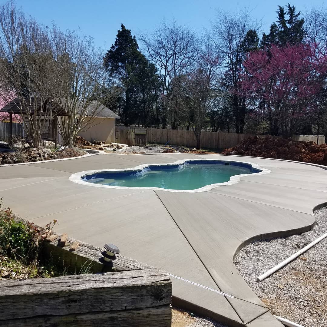 new pool with concrete deck